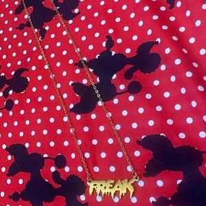 “Freak” drip letter gold necklace